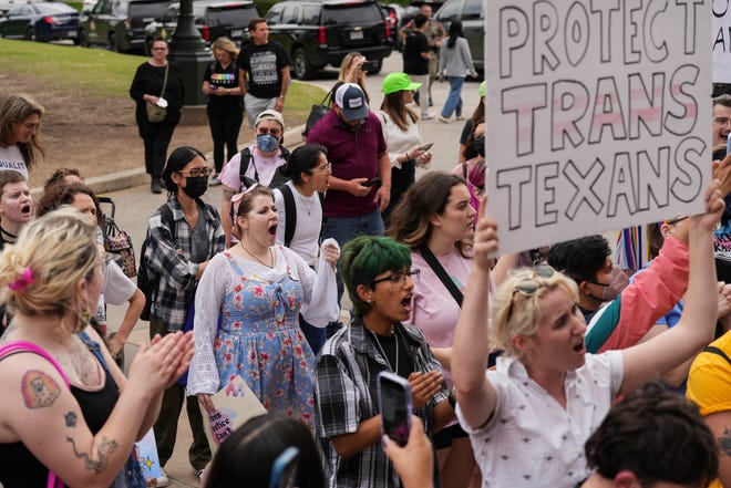 LGBTQ+ rights activists protest  Senate Bill 14 last May. SB 14 banned gender-affirming medical care for transgender children in Texas.
